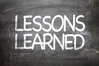 Lessons Learned written on a chalkboard